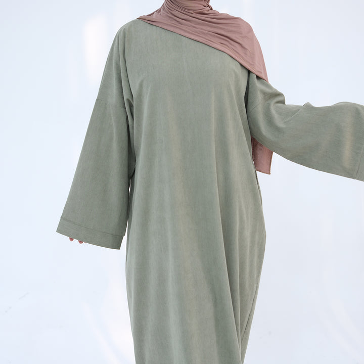 Get trendy with Annan Corduroy Abaya Dress - Sage - Dresses available at Voilee NY. Grab yours for $62.90 today!