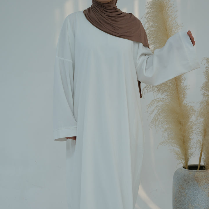 Get trendy with Annan Corduroy Abaya Dress - White - Dresses available at Voilee NY. Grab yours for $62.90 today!