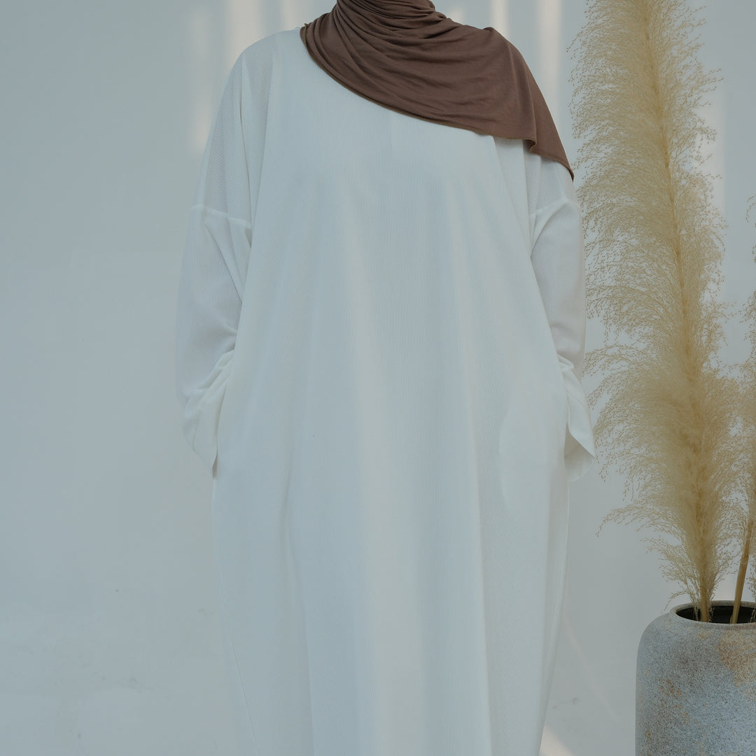 Get trendy with Annan Corduroy Abaya Dress - White - Dresses available at Voilee NY. Grab yours for $62.90 today!