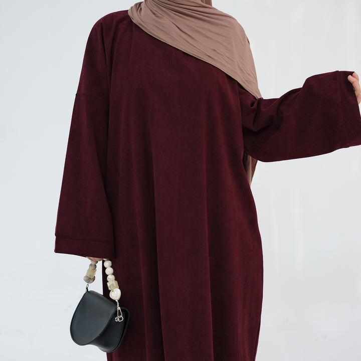 Get trendy with Annan Corduroy Abaya Dress - Wine - Dresses available at Voilee NY. Grab yours for $62.90 today!