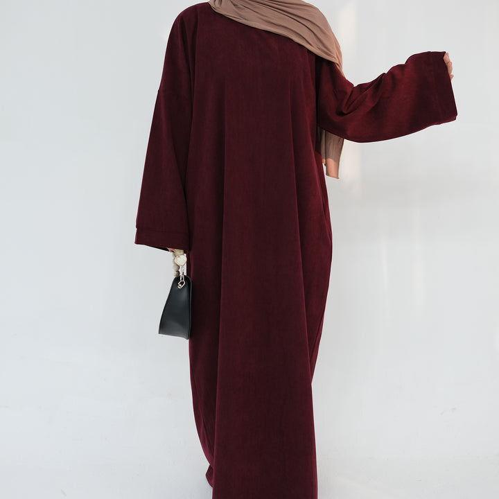 Get trendy with Annan Corduroy Abaya Dress - Wine - Dresses available at Voilee NY. Grab yours for $62.90 today!