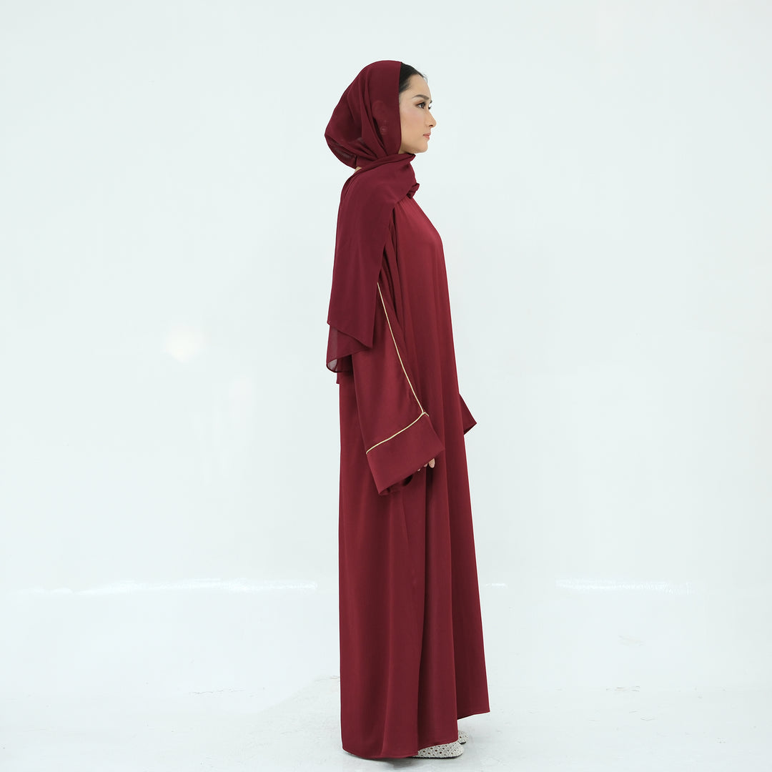 Get trendy with Ayana Textured Piping Detail Abaya - Red - Dresses available at Voilee NY. Grab yours for $49.90 today!