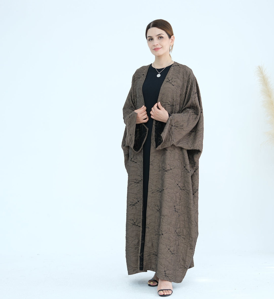 Get trendy with Nixie Textured Reversible Kimono Abaya - Brown Black - Cardigan available at Voilee NY. Grab yours for $74.90 today!