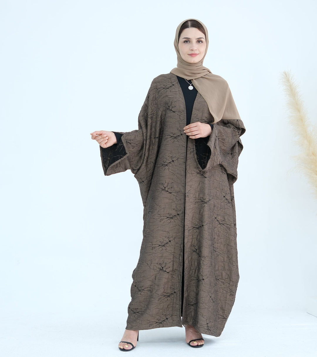 Get trendy with Nixie Textured Reversible Kimono Abaya - Brown Black - Cardigan available at Voilee NY. Grab yours for $74.90 today!