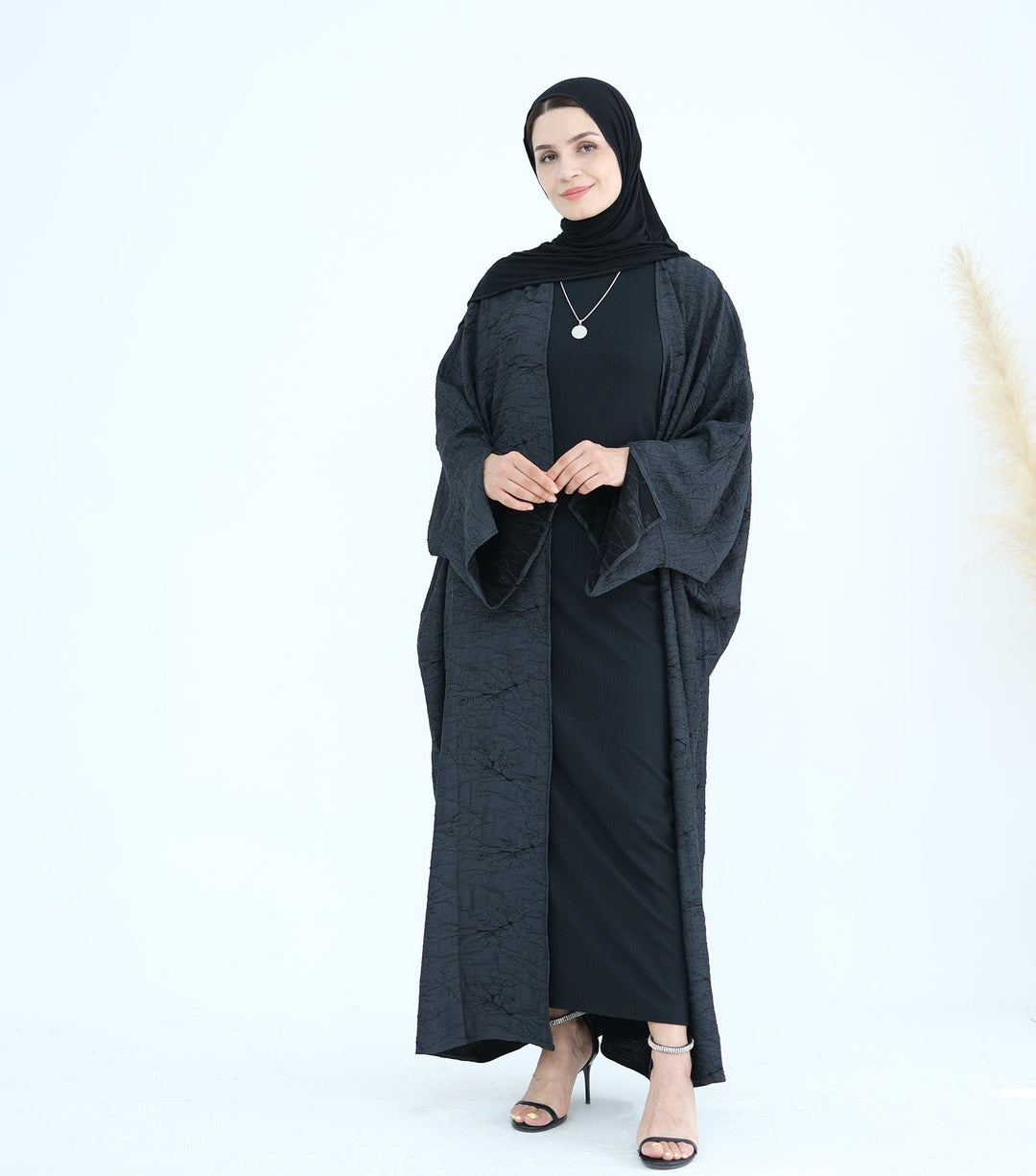 Get trendy with Nixie Textured Reversible Kimono Abaya - Gray Black - Cardigan available at Voilee NY. Grab yours for $74.90 today!