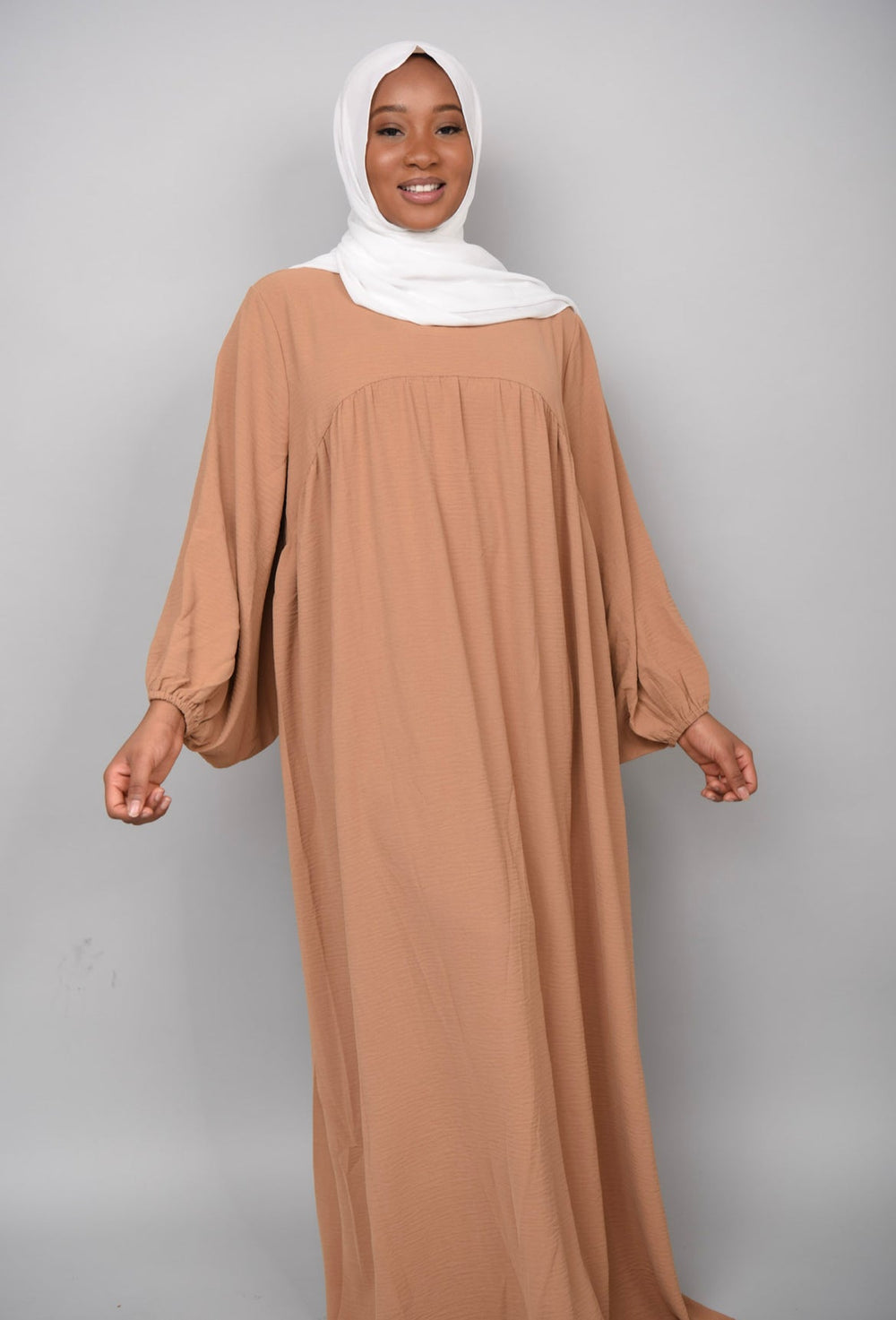 Get trendy with Amelia Textured Abaya - Camel -  available at Voilee NY. Grab yours for $54.90 today!