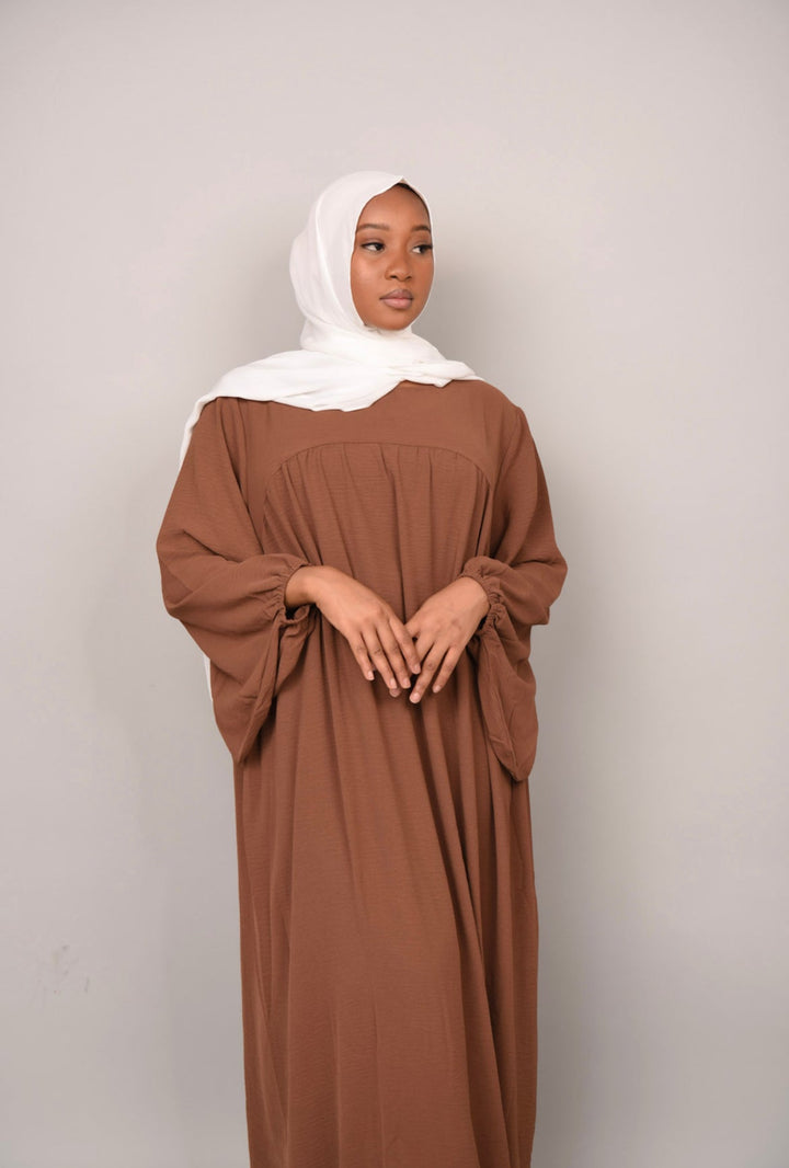 Get trendy with Amelia Textured Abaya - Brown -  available at Voilee NY. Grab yours for $54.90 today!