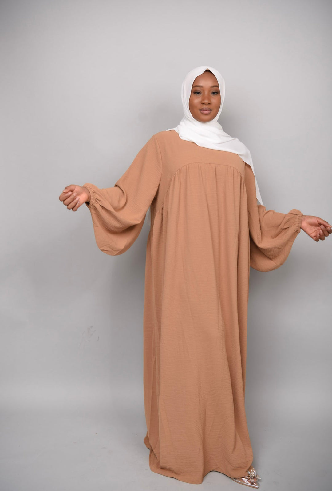 Get trendy with Amelia Textured Abaya - Camel -  available at Voilee NY. Grab yours for $54.90 today!