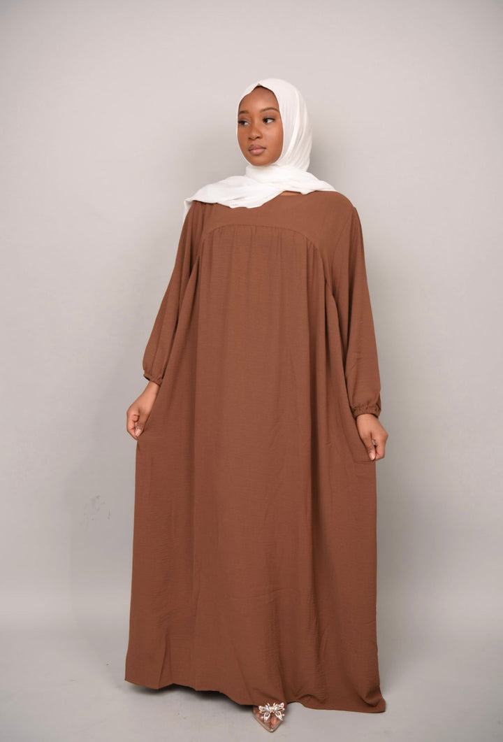 Get trendy with Amelia Textured Abaya - Brown -  available at Voilee NY. Grab yours for $54.90 today!